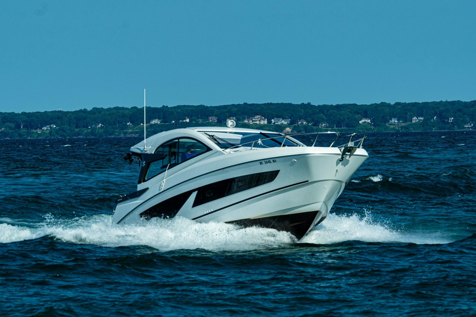 White cabin cruiser running on open water, the kind of tour and sightseeing product operators sell online